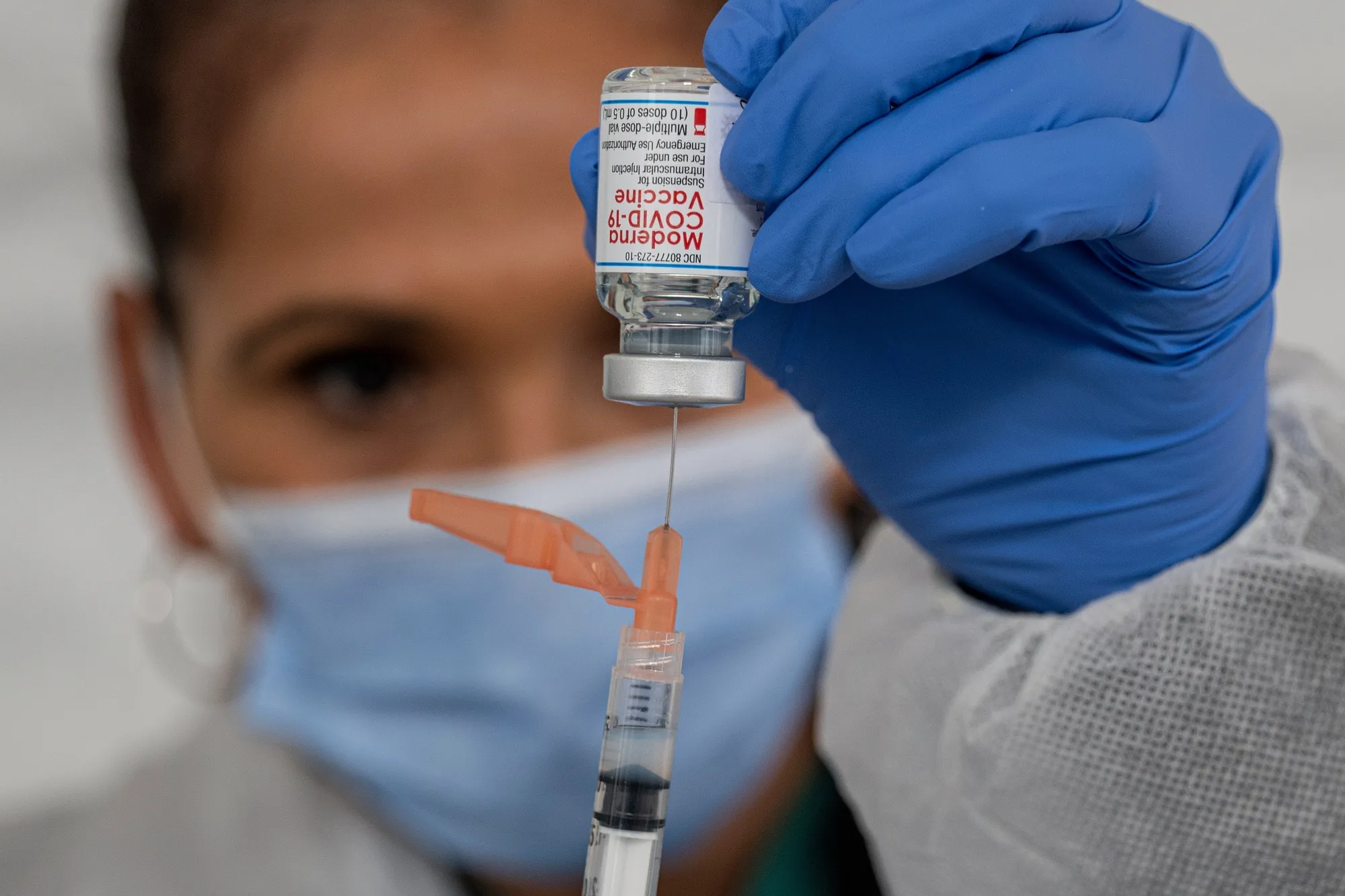 A healthcare worker prepares a dose of the Moderna Covid-19 vaccine.