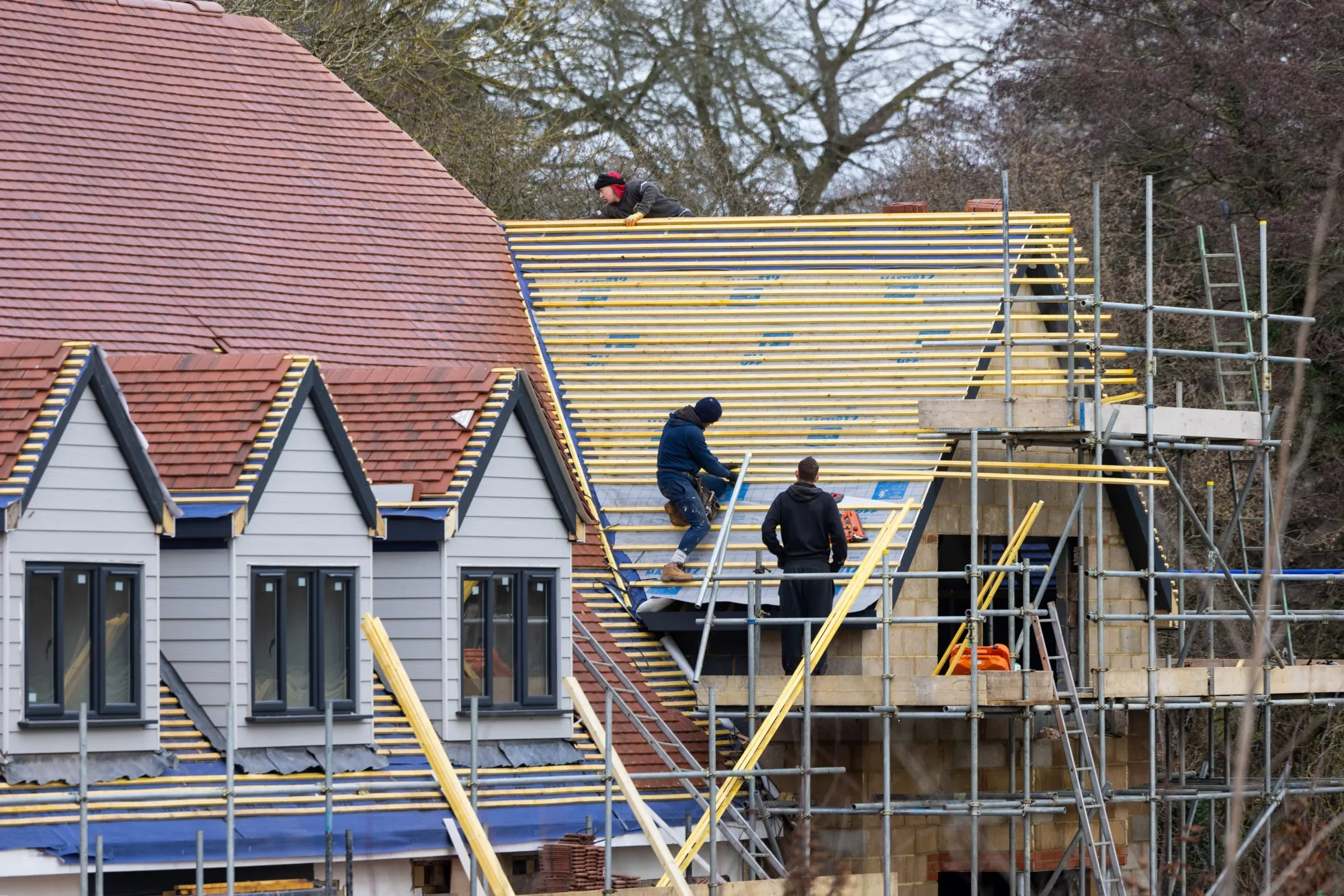 Construction workers on a&nbsp;new build home in Braintree, UK.