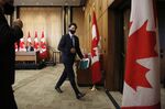 Justin Trudeau leaves an Ottawa news conference on Oct. 9.