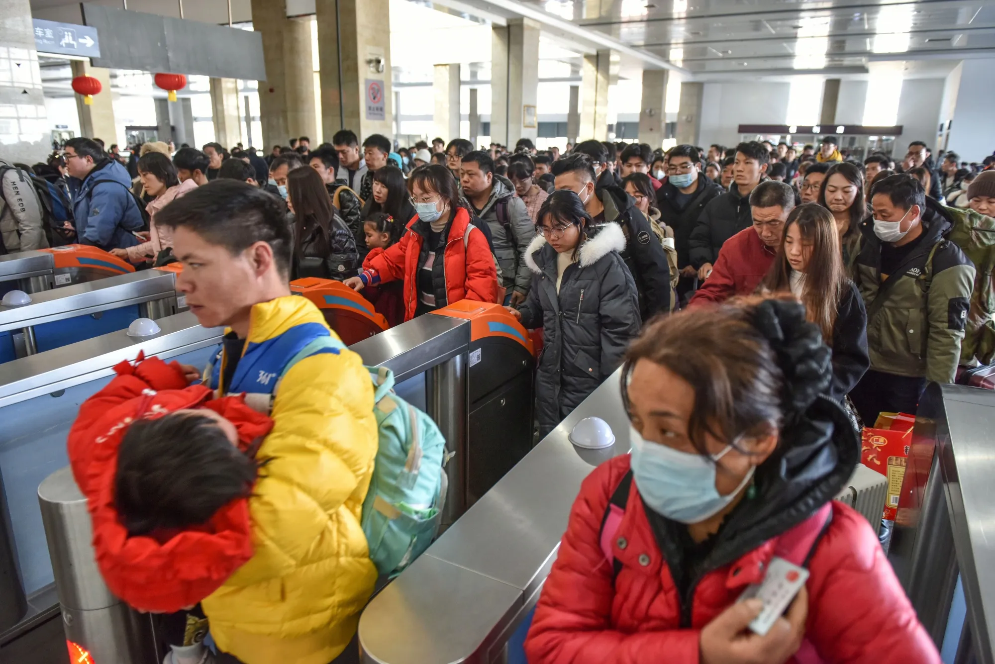 Passengers at a train station in Fuyang, Anhui province on Feb. 16.