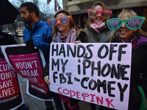 Protesters demonstrate outside the FBI headquarters building in Washington, D.C. on Feb. 23, 2016.