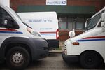 United States Postal Service&nbsp;mail delivery vehicles parked outside a distribution center in Chicago.