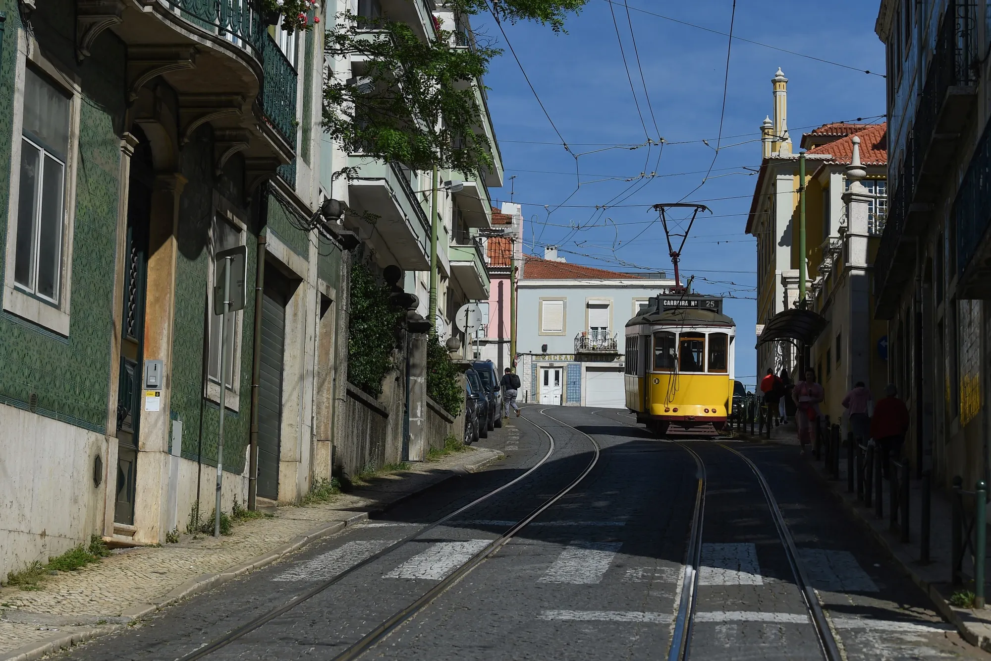 A tram travels along a street&nbsp;in central Lisbon, Portugal.
