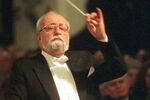 Polish composer Krzysztof Penderecki conducts the Sinfonia Varsovia orchestra during a special concert in memory of the victims of the Sept. 11 terrorist attacks in the U.S., at Warsaw's Holy Cross church, Sunday, Dec. 2, 2001. The ashes of Poland’s award-winning composer and conductor Krzysztof Penderecki were rest during a state funeral Tuesday, March 29, 2022, after a two-year delay brought on by the pandemic. (AP Photo/Alik Keplicz, File)
