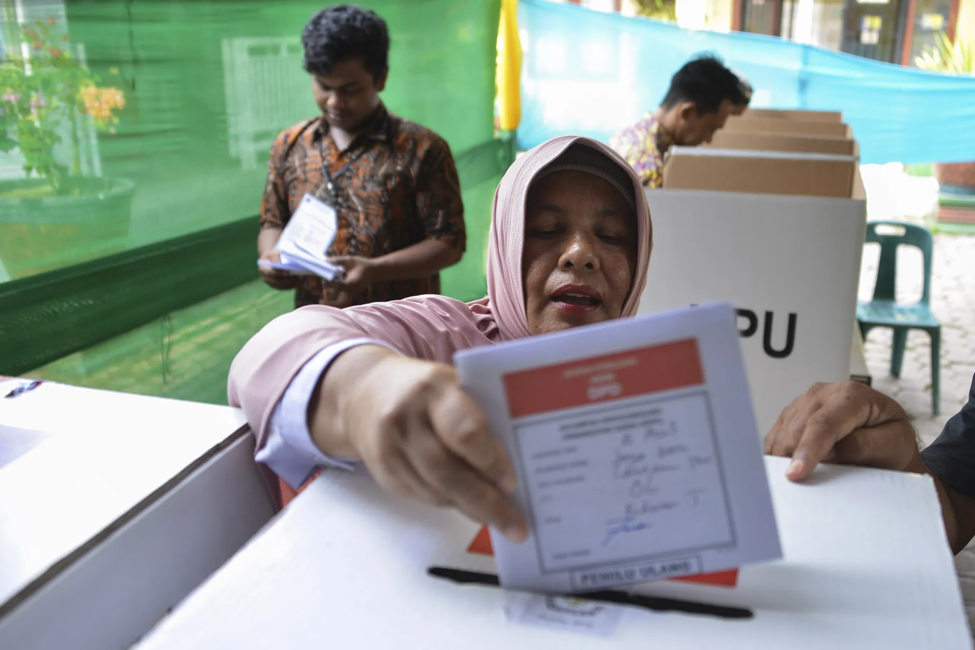 A woman casts her ballot in Banda Aceh on April 25, 2019.