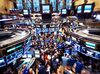 Traders work on the floor of the New York Stock Exchange (NYSE) in New York, U.S., on Friday, Sept. 23, 2016. U.S. stocks slipped as investors considered whether shares have climbed too far too fast, after a rally spurred by central-bank optimism put the S&P 500 Index on track for its best weekly advance in two months.