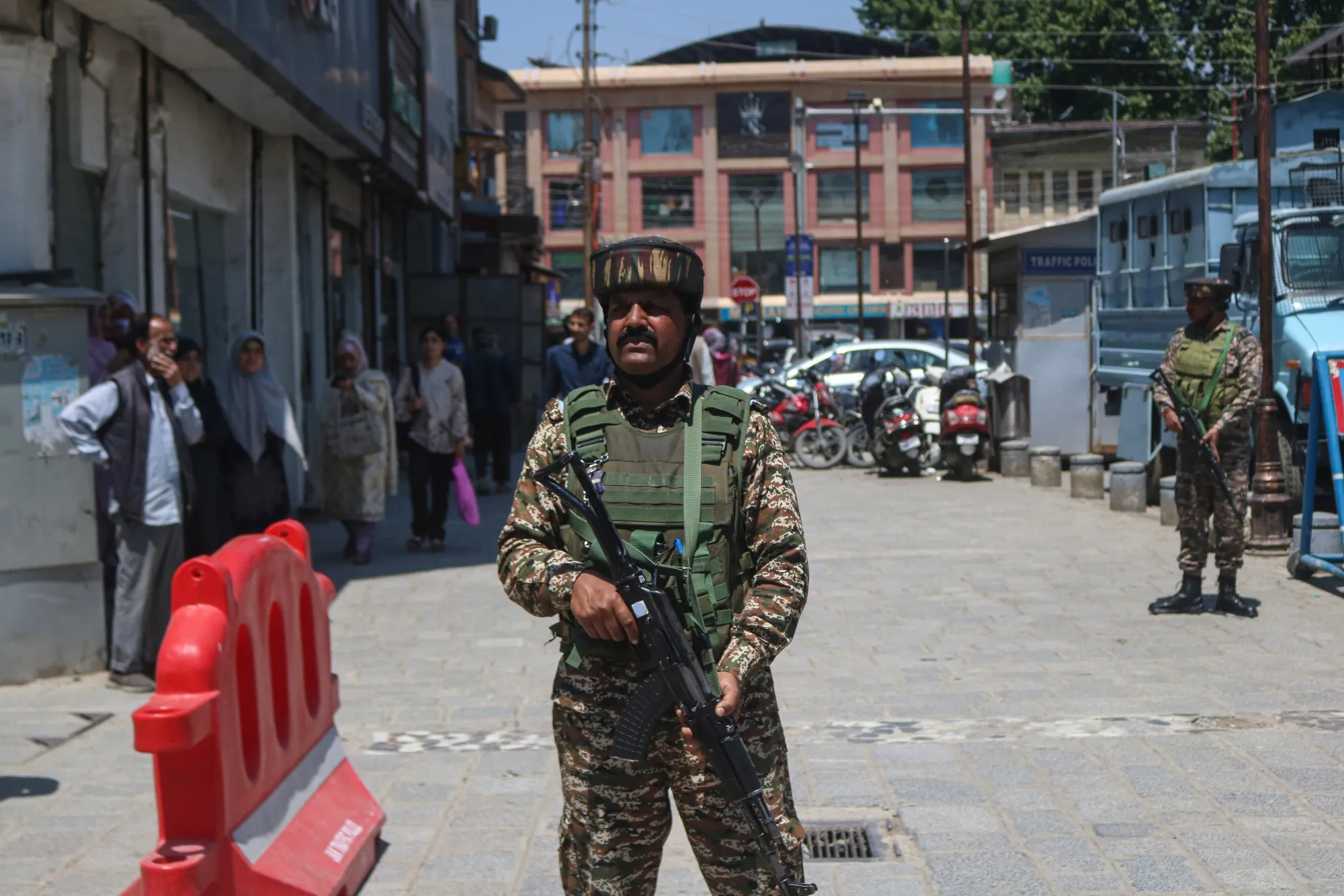 An Indian paramilitary soldier stands guard along a road in Srinagar, Jammu and Kashmir, on April 30.