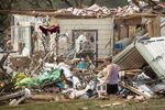 Michelle Light salvages belongings from her home on FM 2843 and Cedar Valley Road near Salado, Texas, on Wednesday, April 13, 2022, a day after a tornado destroyed the house. (Jay Janner/Austin American-Statesman via AP)