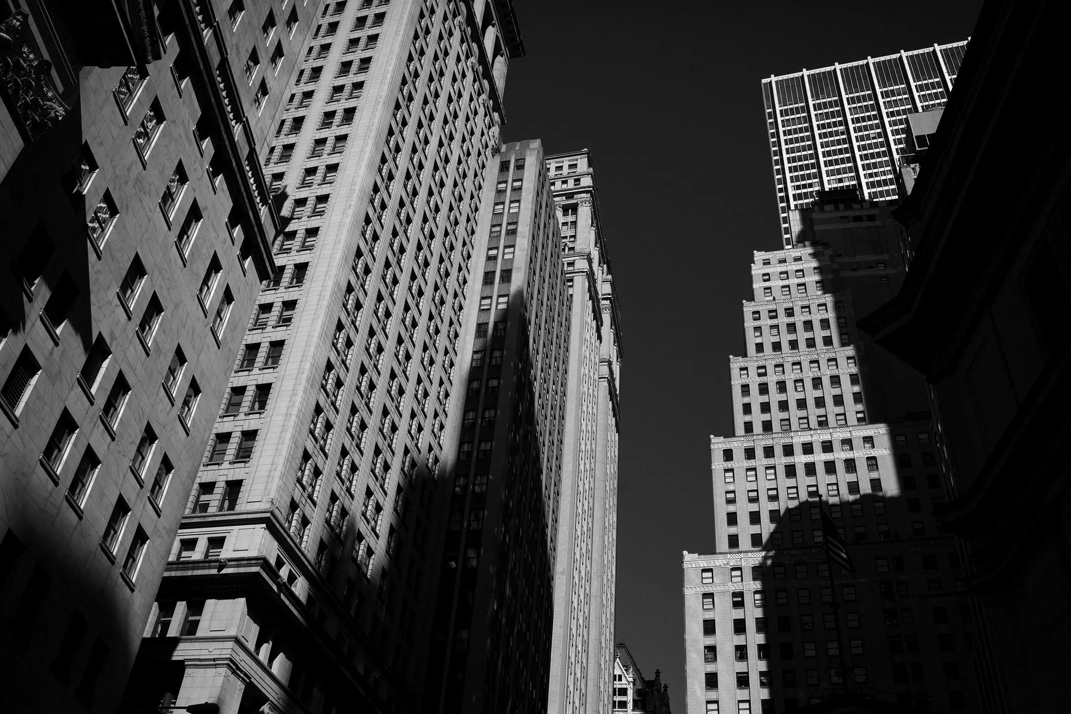 Buildings stand on Wall Street near the New York Stock Exchange (NYSE) in New York, U.S.