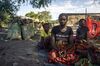 Climate change becomes a vicious circle. Namasiku Imasiku cuts down trees, covers the wood in sand, and burns it to make charcoal that she bags and sells in town, three hours away. More people are doing the same as rural incomes slide, causing prices to plunge and accelerating deforestation, a major contributor to global warming. With the water so low, dams are generating far less electricity, so there are plenty of buyers for the ­charcoal, which they need for cooking. 