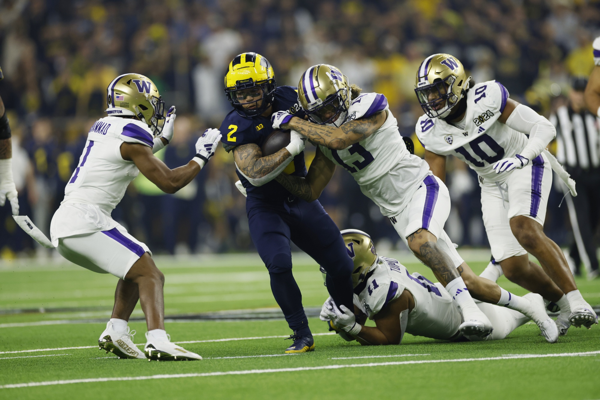 Michigan overpowers Washington 34 13 as Jim Harbaugh delivers a