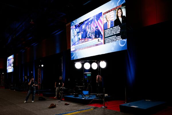  Donald Trump and  Kamala Harris on a screen in the spin room ahead of the second presidential debate.