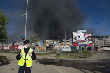 Smoke from a fire at a shopping center in Warsaw in May 2024.
