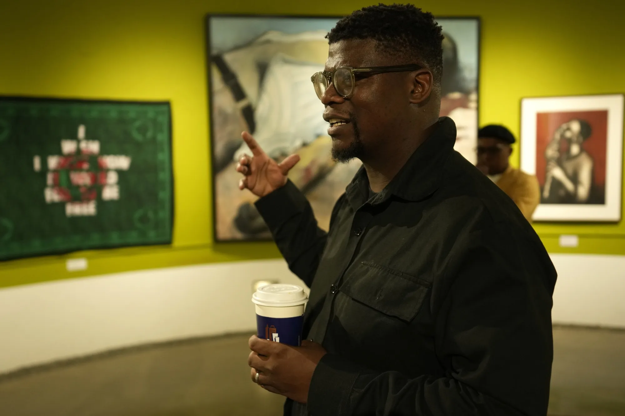 Artist Lawrence Lemaoana at an exhibition at the Apartheid Museum in Johannesburg, South Africa, Wednesday, April 24, 2024. A selection of artworks which were produced during the country's apartheid era and ended up in foreign art collections are on display to mark 30 years since the country's transition to democracy in 1994. (AP Photo/Themba Hadebe)
