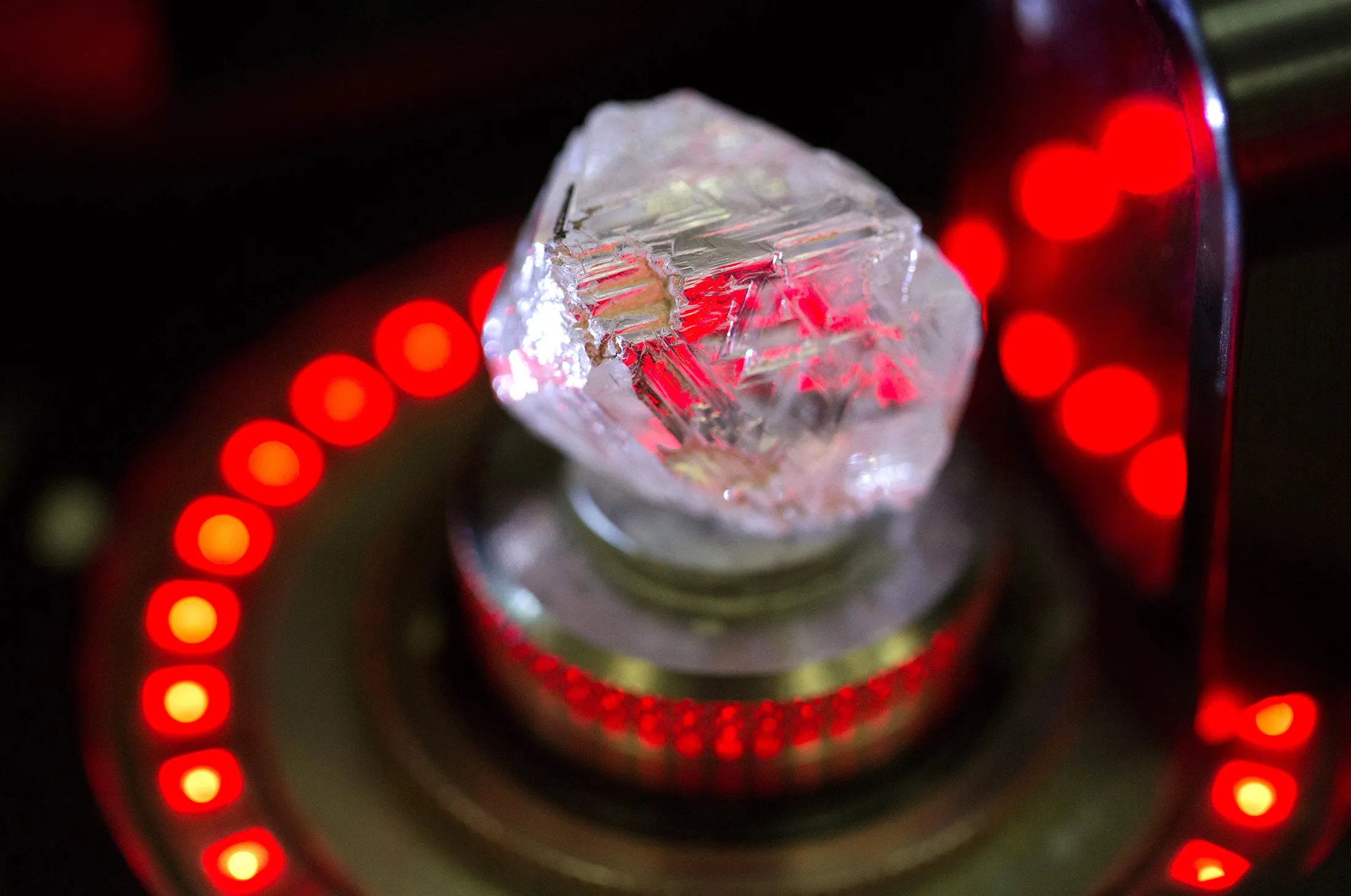 A natural diamond is scanned by a laser machine before being cut.
