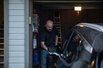 Neil Wintle plugs in his Bolt EV in his garage in Gilbert, Arizona, on Aug. 31.