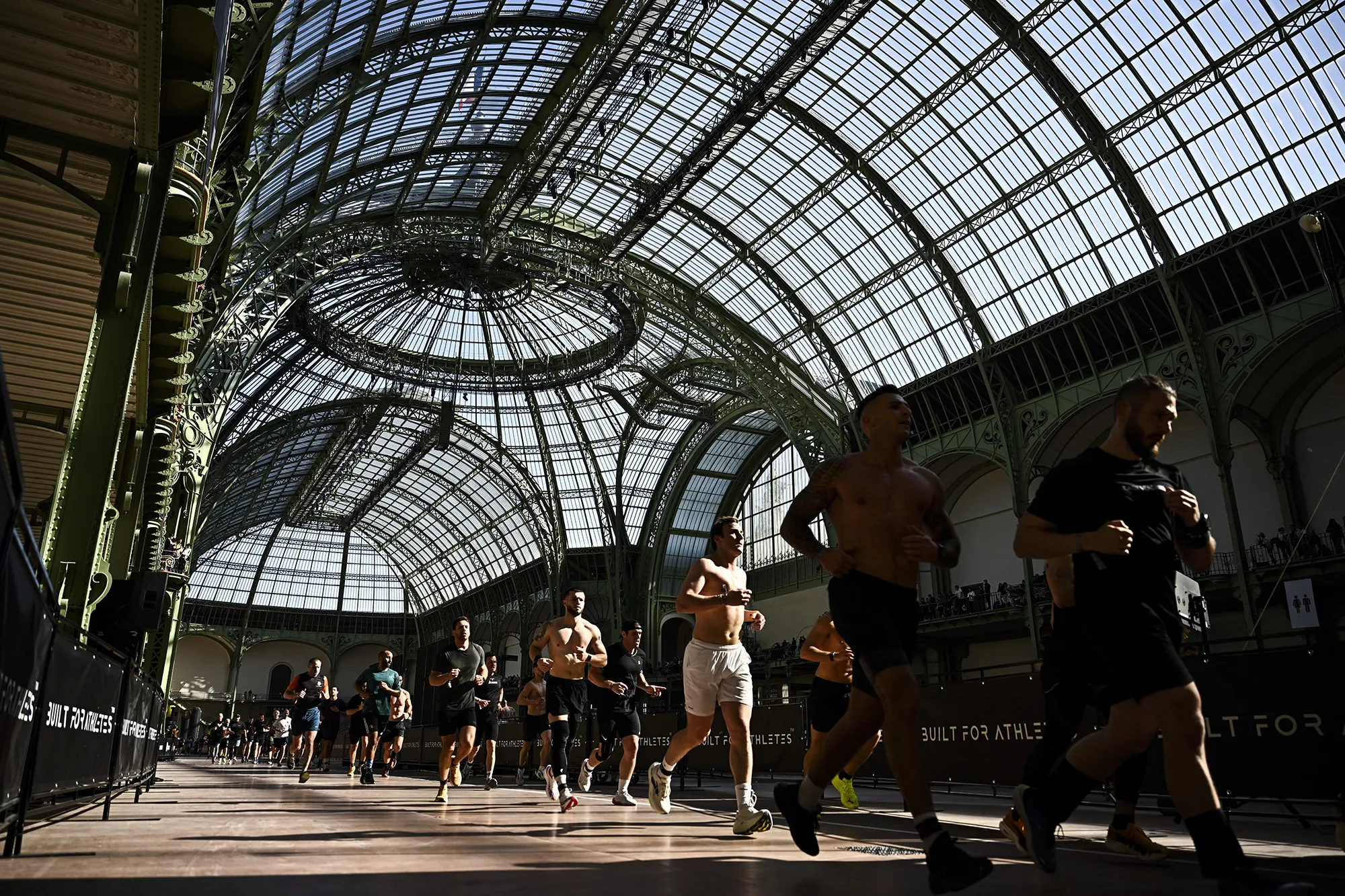 Participants run during the Hyrox fitness race in Paris.
