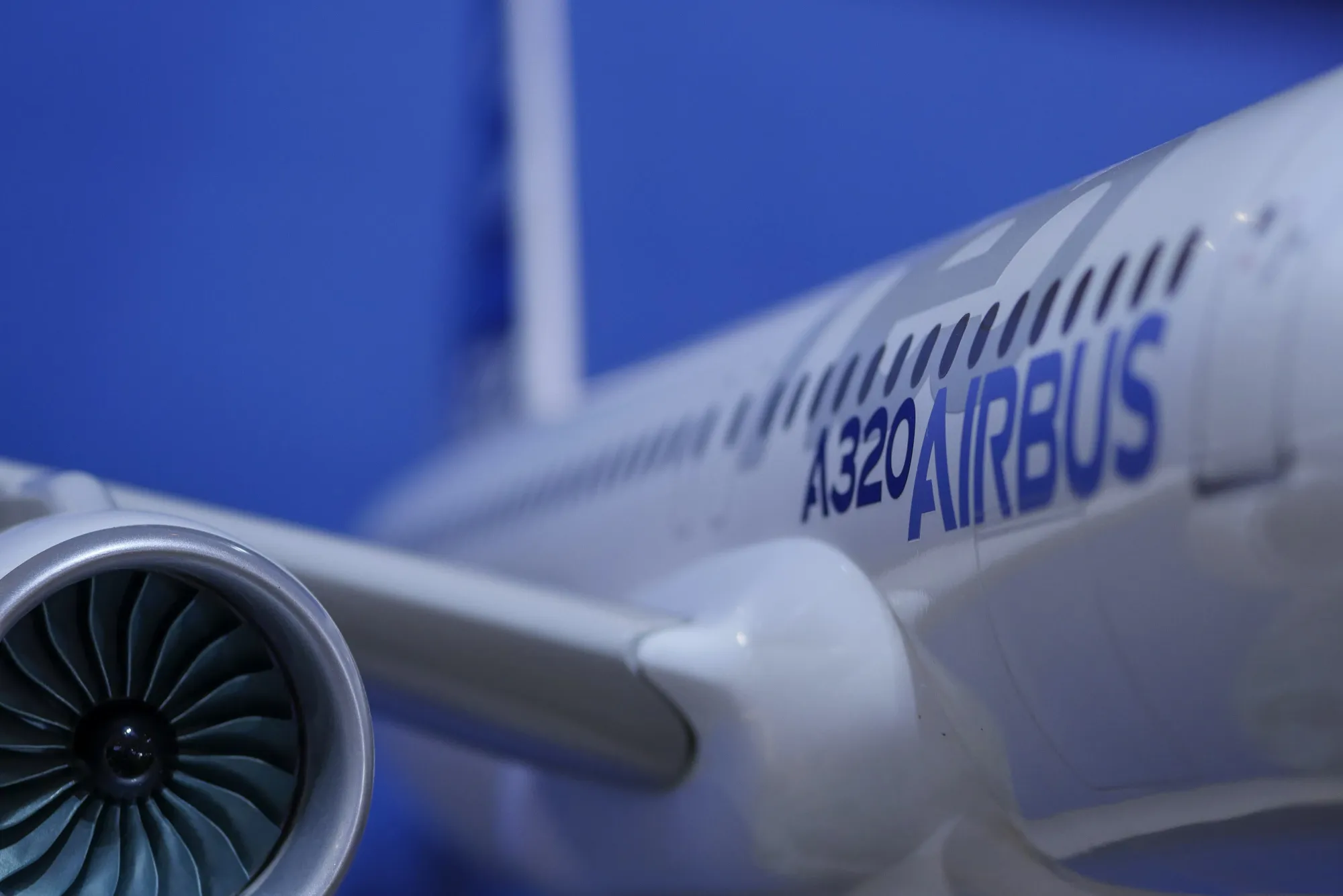 A model of an Airbus SE A320 aircraft sits on display at company's booth during the Aero India air show at Air Force Station Yelahanka in Bengaluru, India, on Wednesday, Feb. 15, 2017. More than 750 global and Indian companies will attend the international show which runs through Feb. 18.