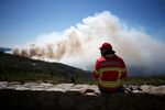 The long, hot summer: A firefighter in Portugal battles a wildfire as extreme heat in Europe continues.