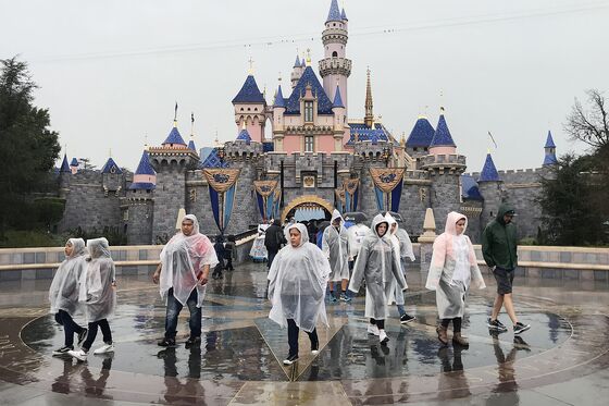 Disney Fans Descend on Theme Parks Before Virus Shuts Them Down