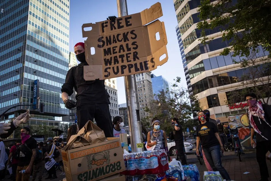 Hungry for change: A protester manning a supply station in Oakland on June 3.