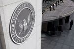 The U.S. Securities and Exchange Commission seal is displayed outside the headquarters in Washington, D.C., U.S., on Wednesday, Oct. 26, 2011. The SEC approved a rule requiring hedge funds and private-equity funds to reveal internal information to U.S. regulators.
