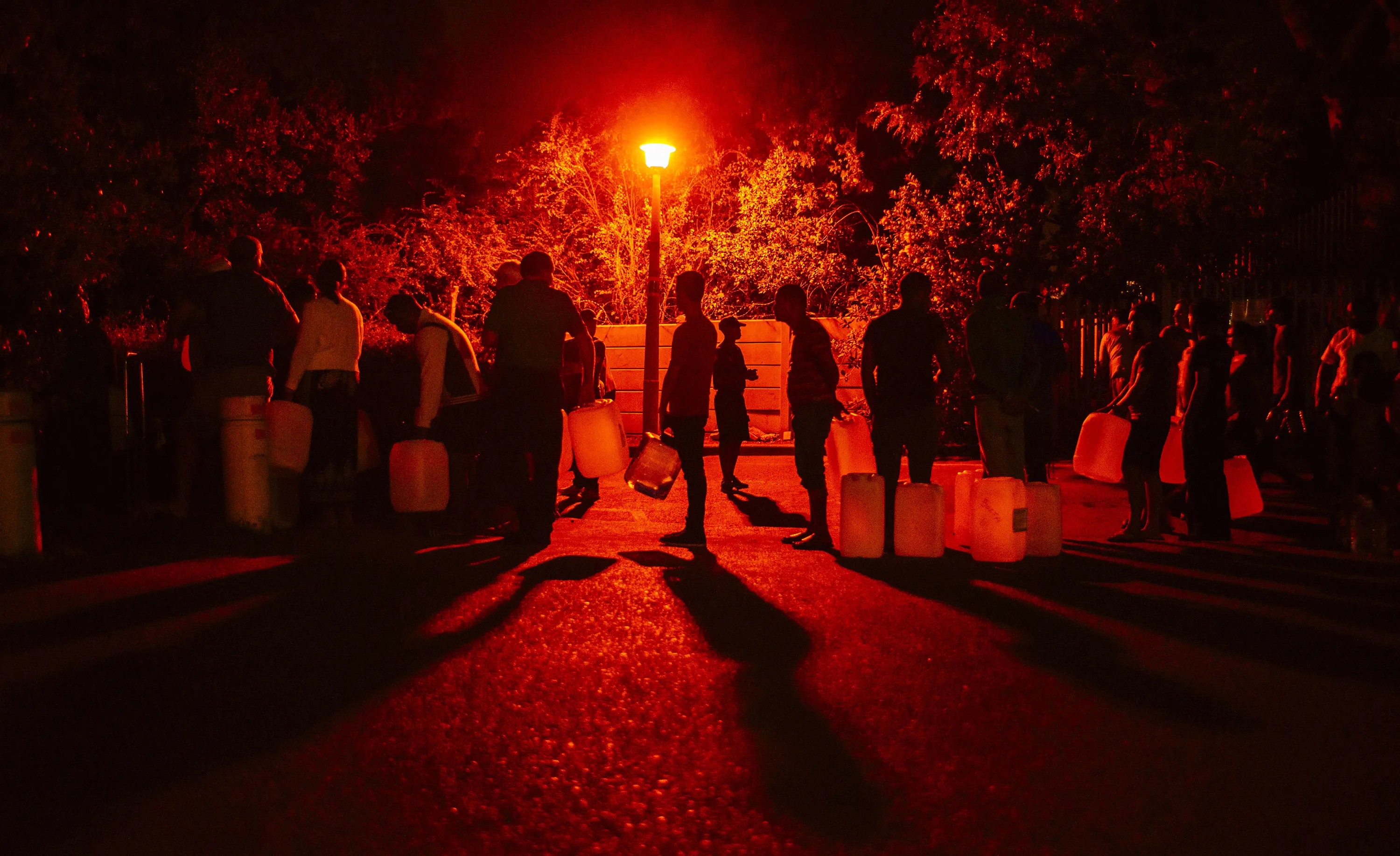 Lining up at the natural spring in Newlands.