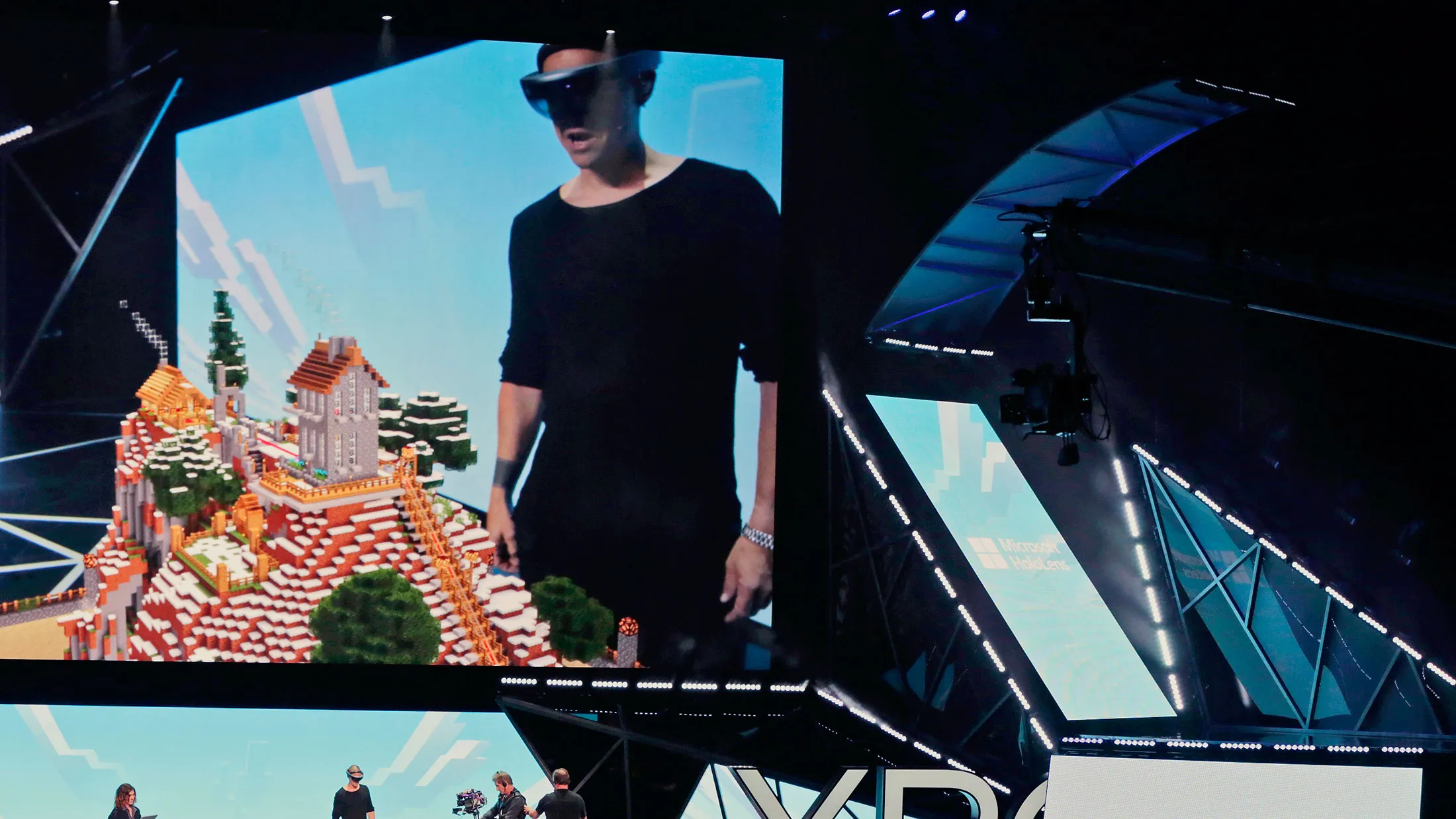 Microsoft Studios executive Saxs Persson demonstrates how the HoloLens is used to play "Minecraft" at the Xbox E3 2015 briefing ahead of the Electronic Entertainment Expo at the University of Southern California's Galen Center on June 15, 2015 in Los Angeles.
