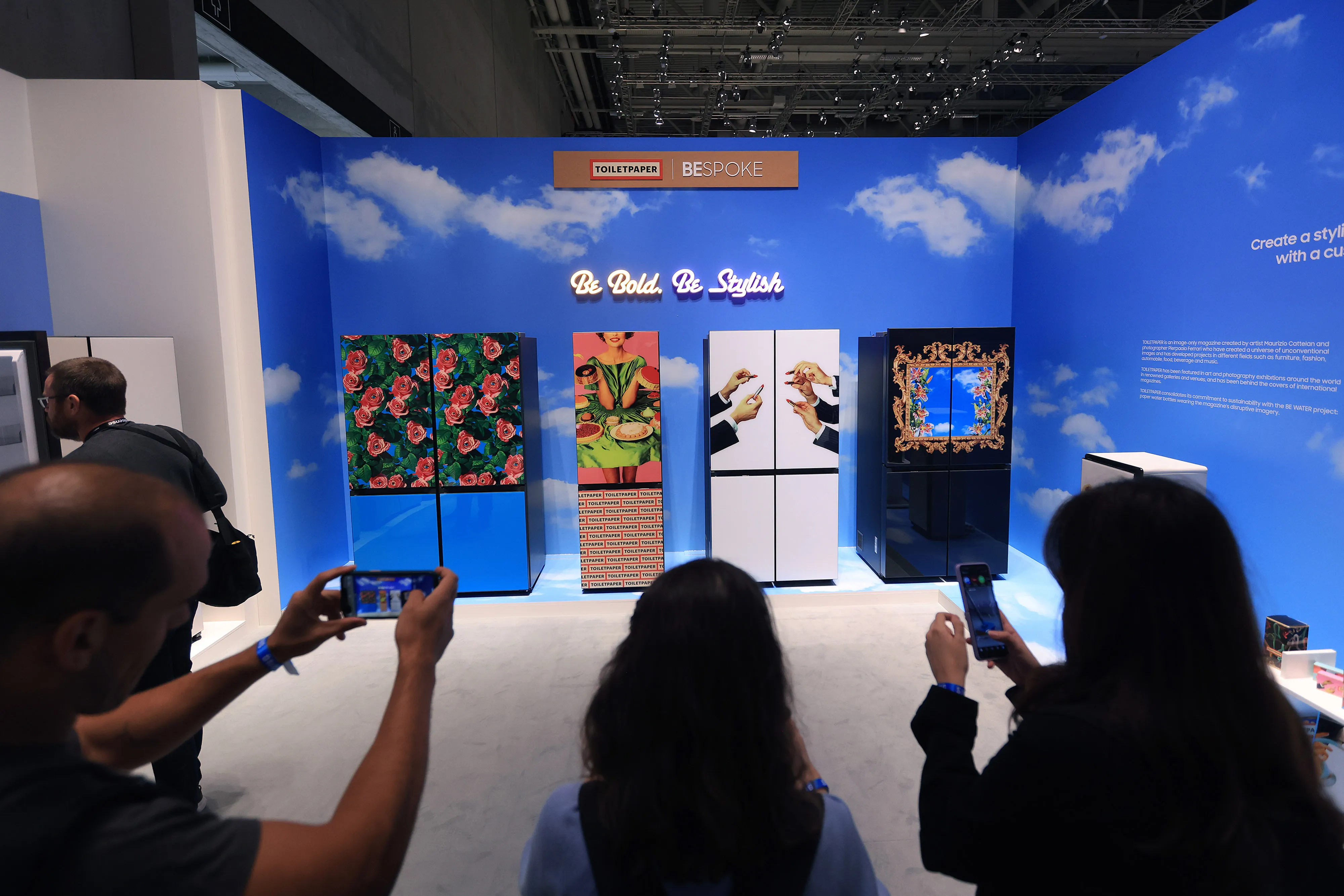 Attendees take photographs of Samsung’s bespoke-designed fridges.