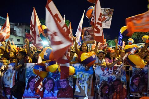 Supporters of Nicolas Maduro attend a rally on Dec. 1