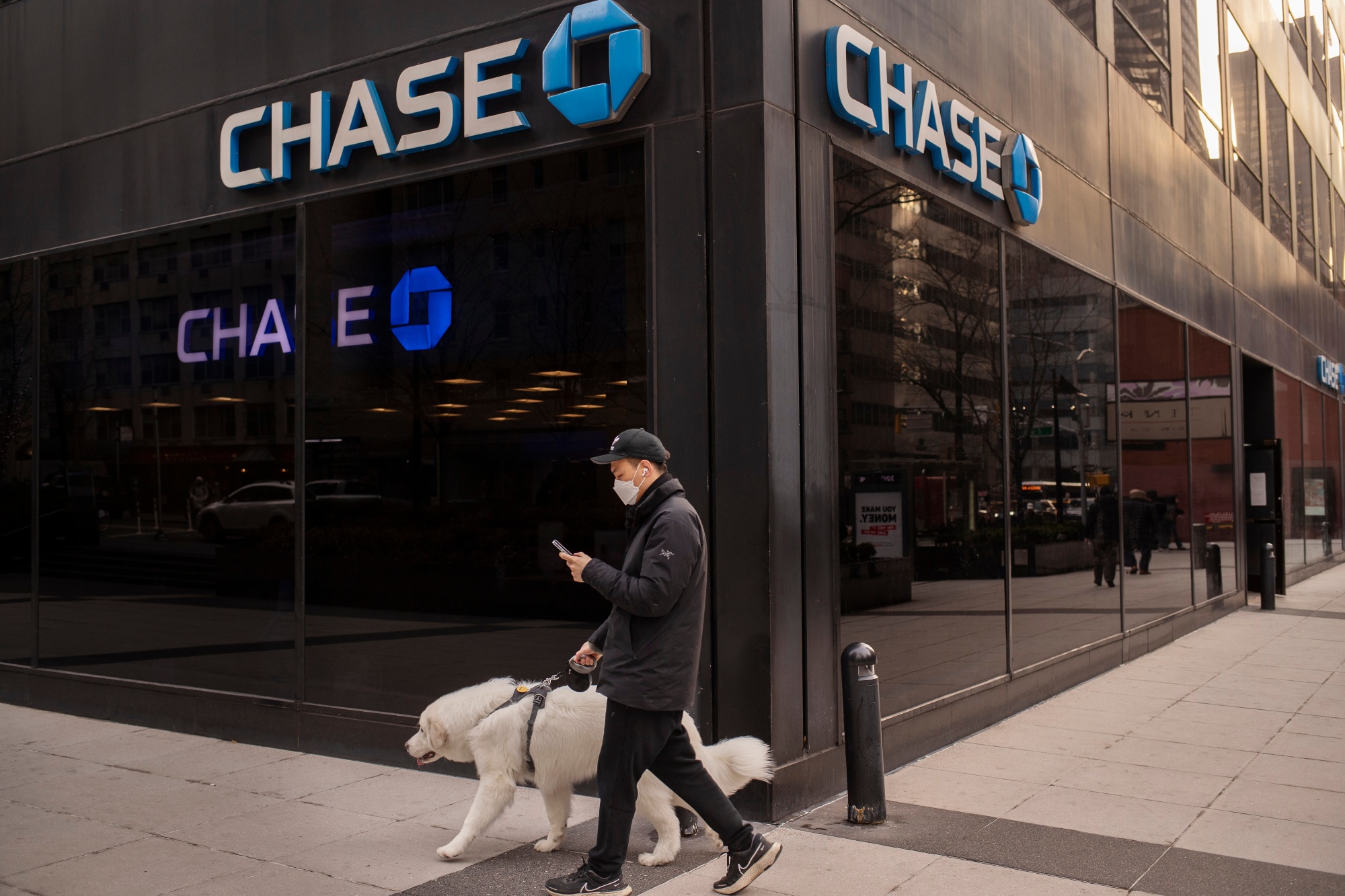 A pedestrian walks past a Chase bank branch in New York on Jan. 13.