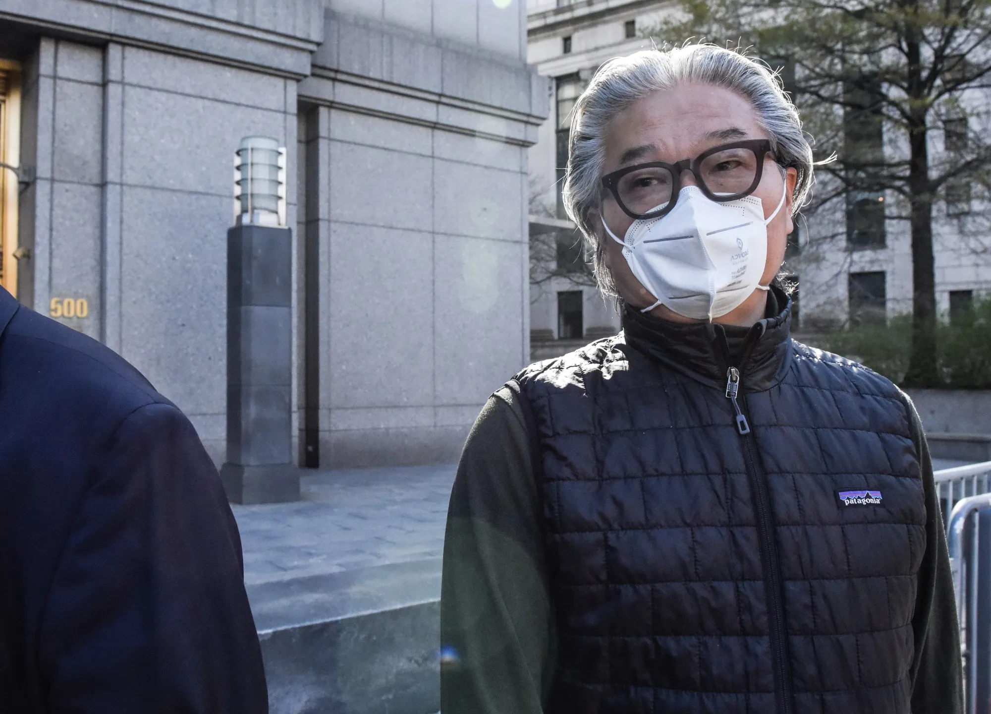 Bill Hwang departs federal court in New York in April 2022.&nbsp;