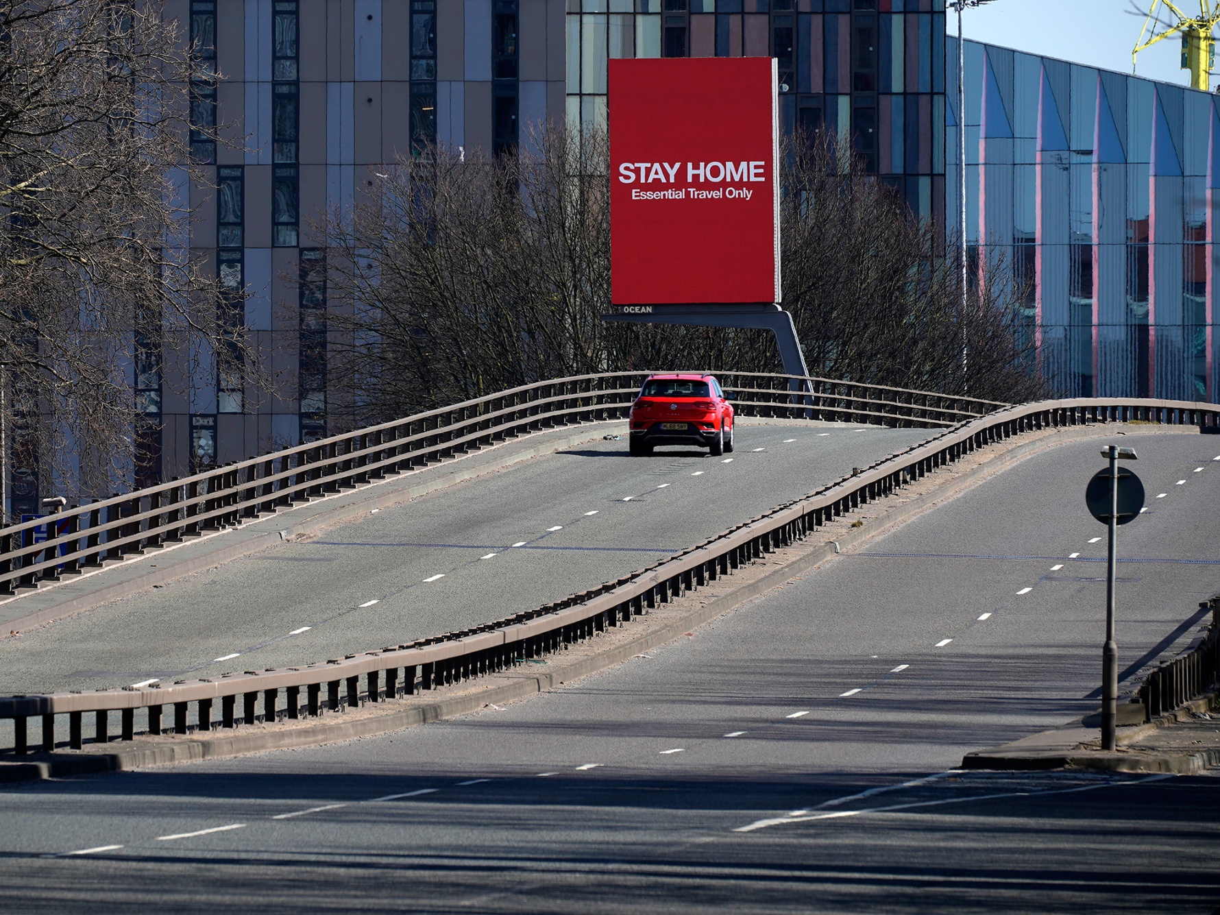 A screen overlooking a main road urges people to stay home, in Manchester U.K., on March 26.