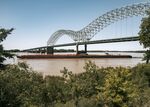 A barge travels along the Mississippi River beneath the Interstate 40 Hernando De Soto Bridge in Memphis, Tennessee on May 14.