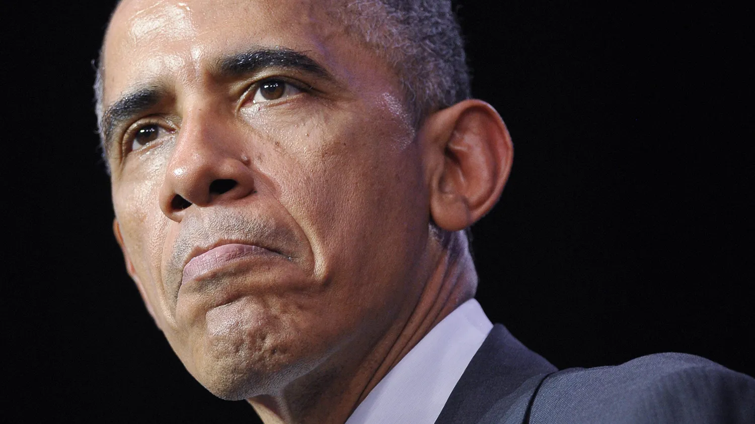 US President Barack Obama pauses as he speaks at the University of Queensland on the sidelines of the G20 Summit in Brisbane on November 15, 2014.
