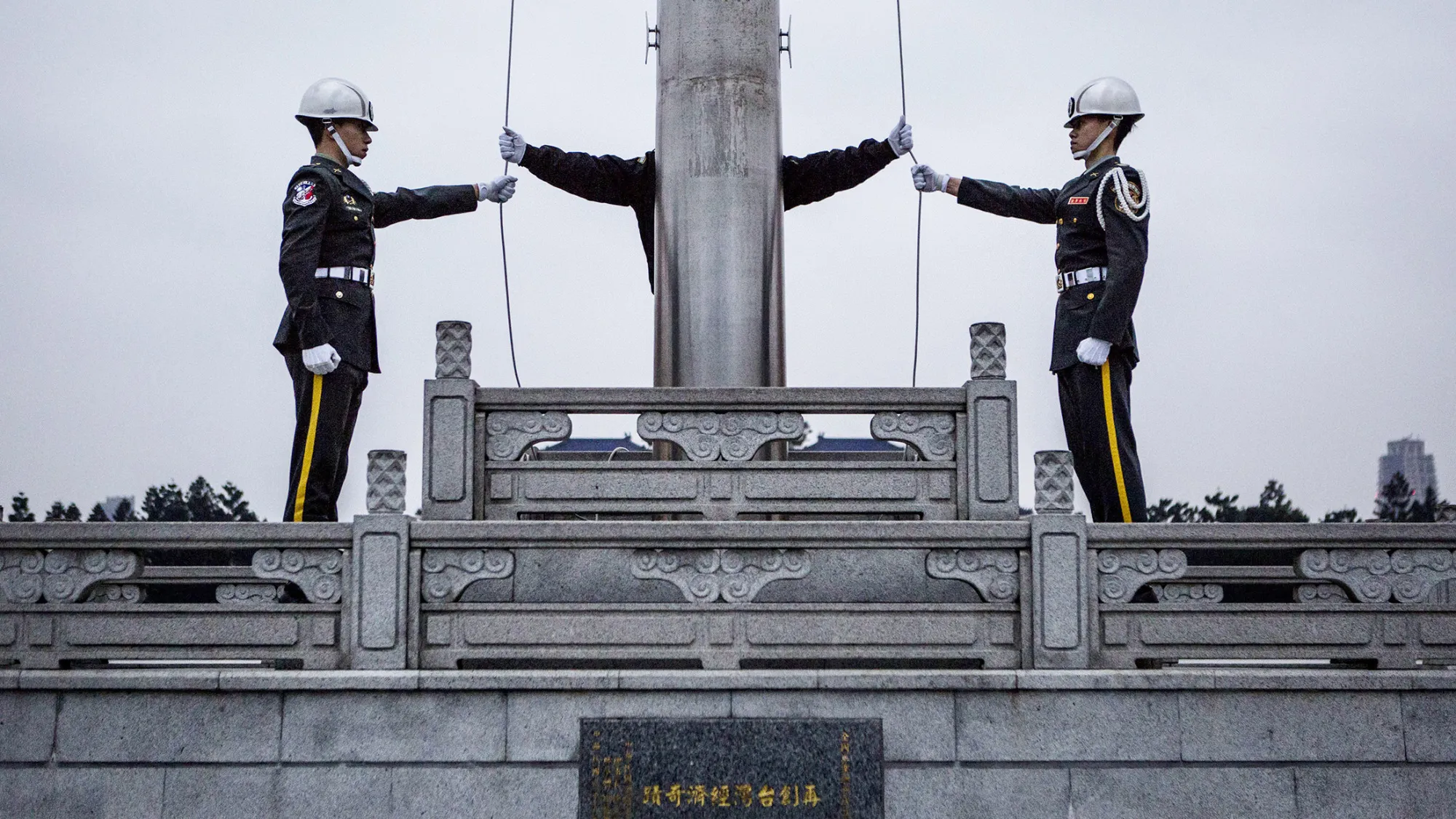 TAIPEI, TAIWAN - JANUARY 14: Honor guards prepare to raise the Taiwan flag in the Chiang Kai-shek Memorial Hall square, ahead of the Taiwanese presidential election on January 14, 2016 in Taipei, Taiwan. Voters in Taiwan are set to elect Tsai Ing-wen, the chairwoman of the opposition Democratic Progressive Party, to become the island's first female leader.
