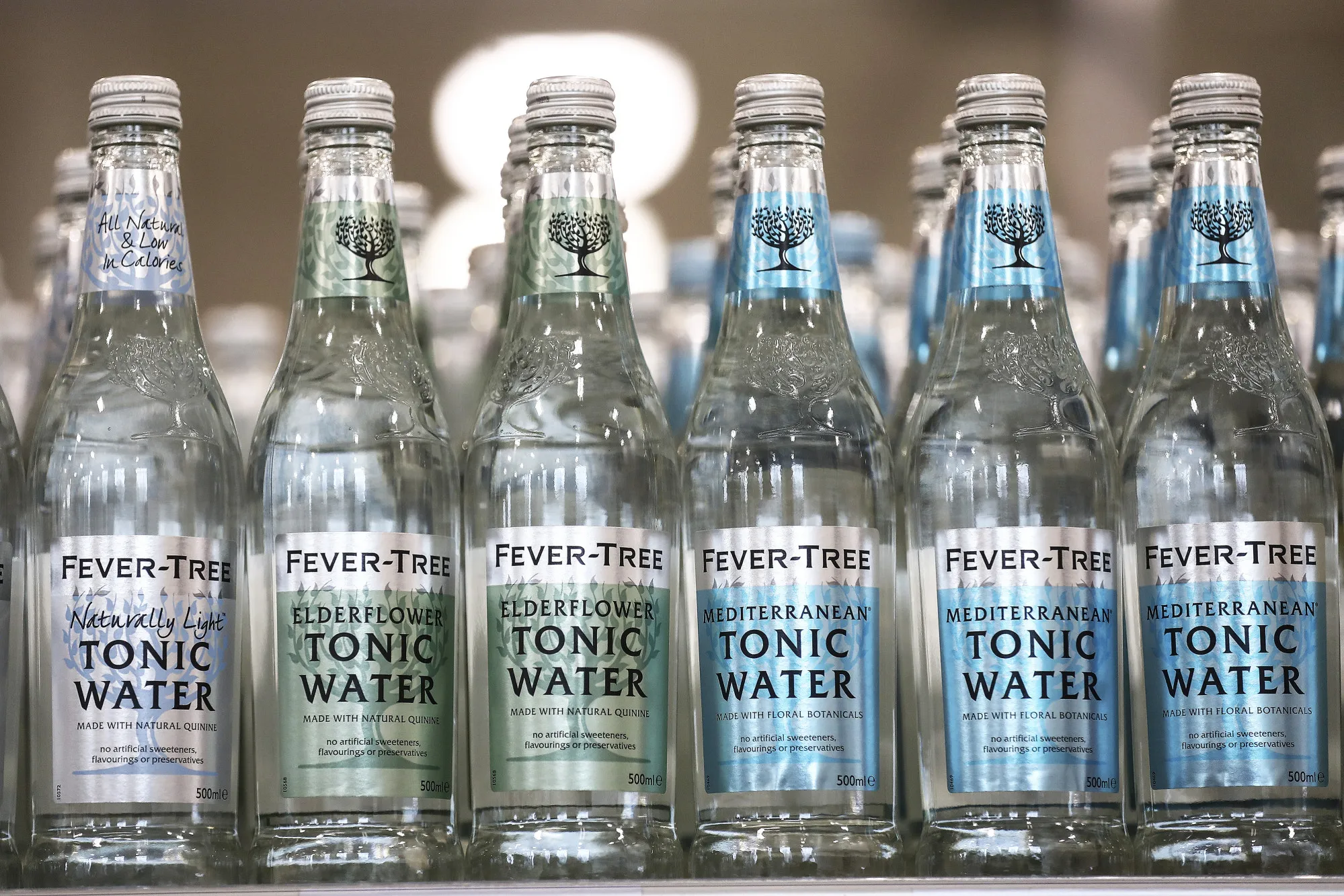 Bottles of Fever-Tree tonic water, produced by Fevertree Drinks Plc, sit on display inside a J Sainsbury Plc supermarket in Redhill, U.K., on Tuesday, March 27, 2018. Mike Coupe, J Sainsbury chief executive officer, spoke of the importance of having a strong online presence and improving efficiency to compete with Amazon.