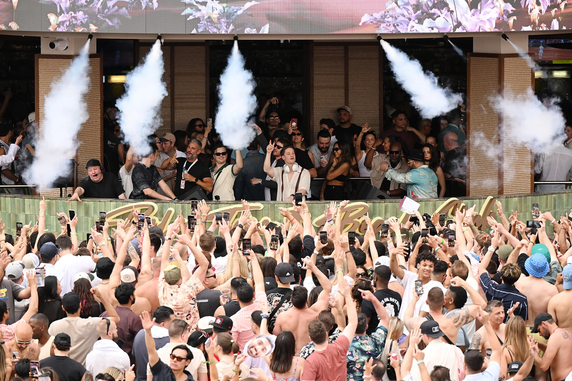 Kygo, center, performs at the opening of the Palm Tree Beach Club in Las Vegas on May 3.