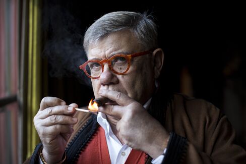 Jean-Yves Ollivier lights a cigar at his residence in Marrakesh, Morocco, on Monday, Dec. 1, 2014.