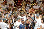 LeBron James of the Miami Heat holds the championship trophy after defeating the Oklahoma City Thunder in Game 5 of the NBA Finals.