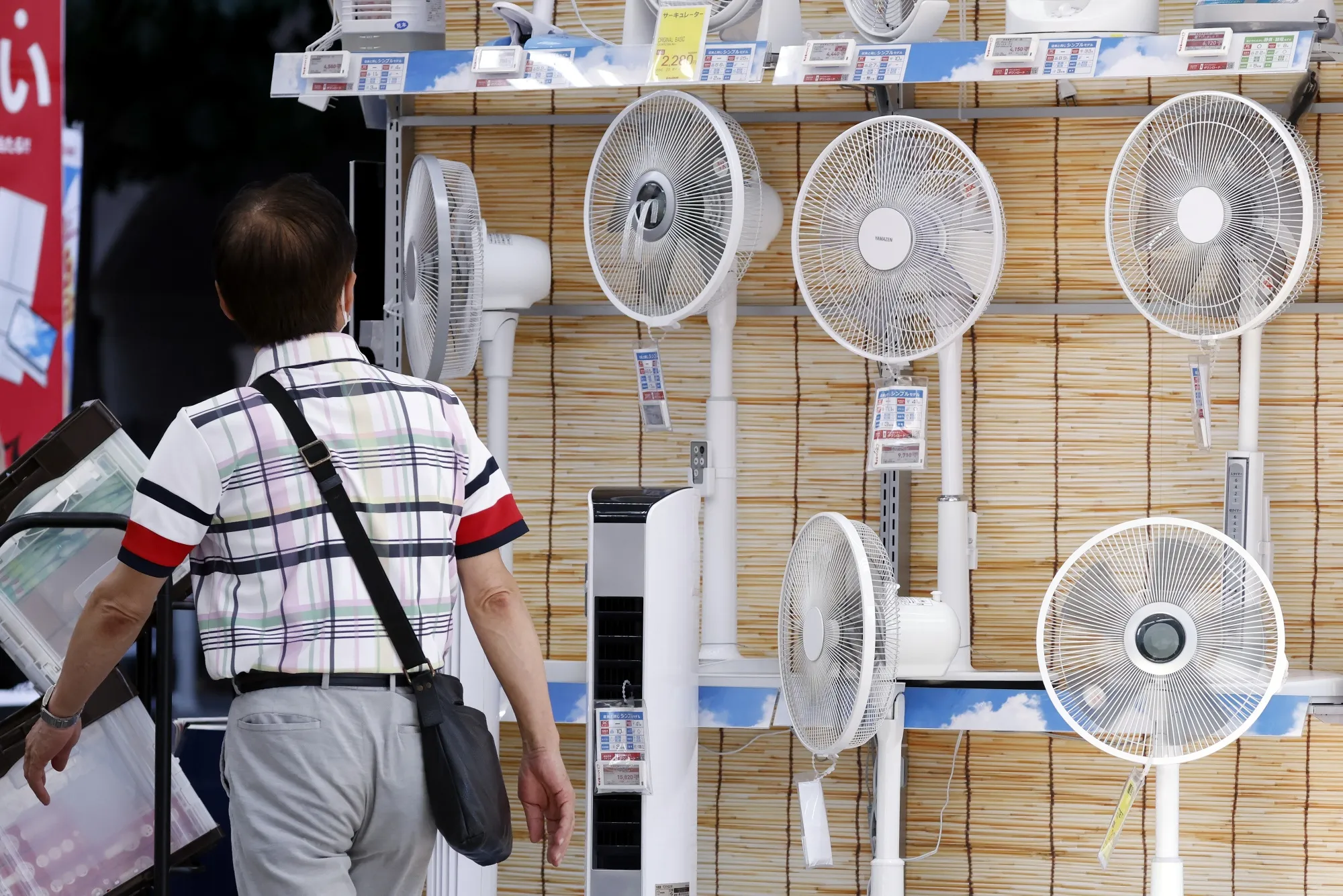Electric fans for sale at an electronics store in Tokyo, on July 1.