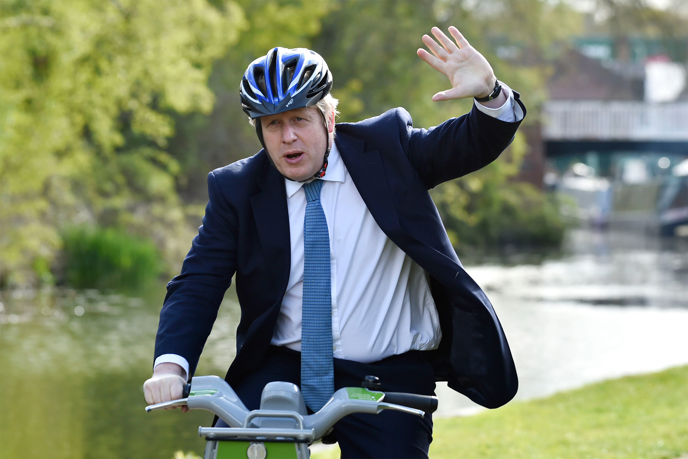 Then-Prime Minister Boris Johnson&nbsp;rides a bike during a Conservative party local election visit in Stourbridge, England, on May 5, 2021.