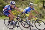 Lance Armstrong (L) rides close to compatriot Tyler Hamilton during the fifth stage of the '56th Criterium du Dauphine Libere, between Bollene and Sisteron, 11 June 2004.&#13;
