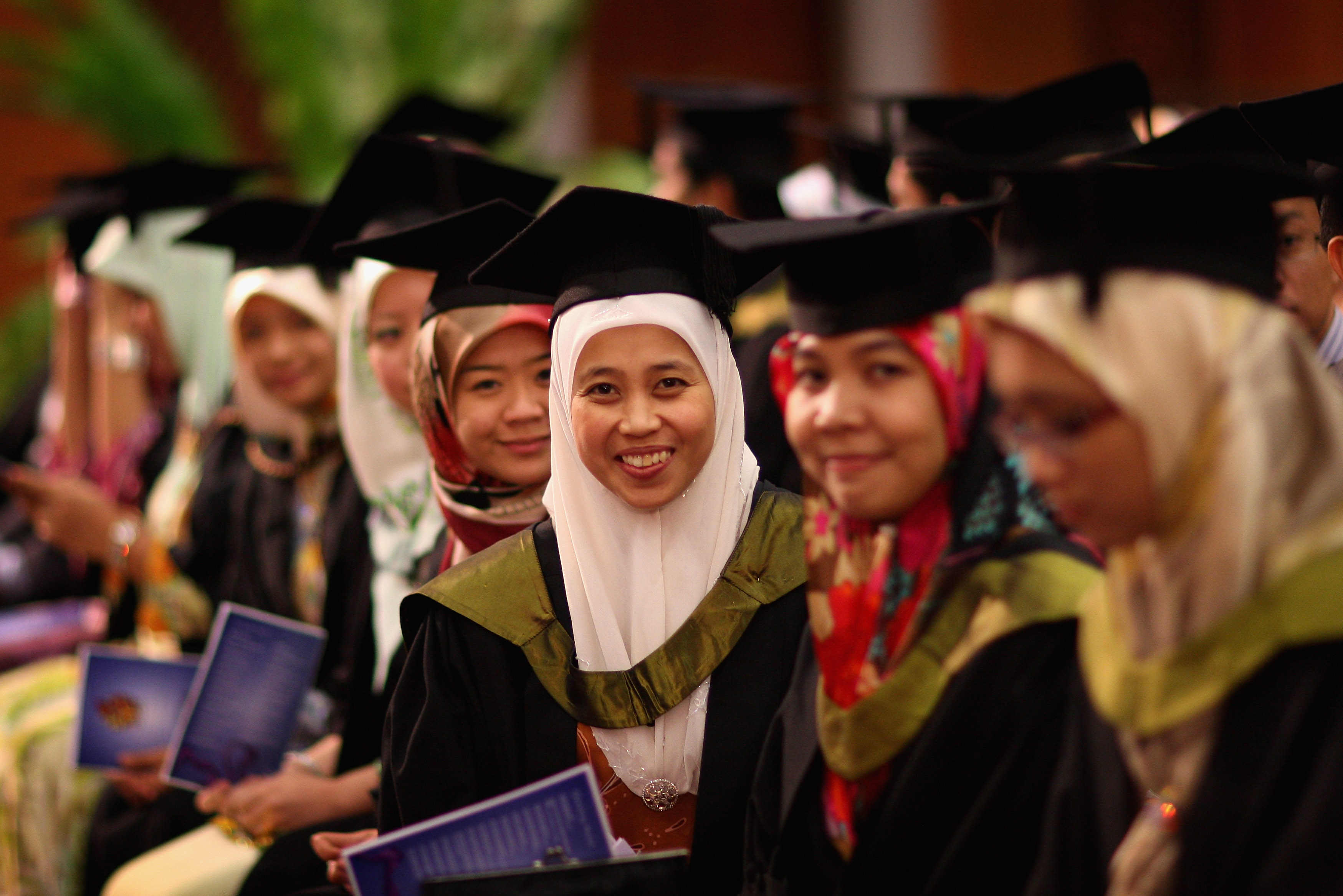 Students at Brunei Darussalam University wait to receive their degrees on November 1, 2008.