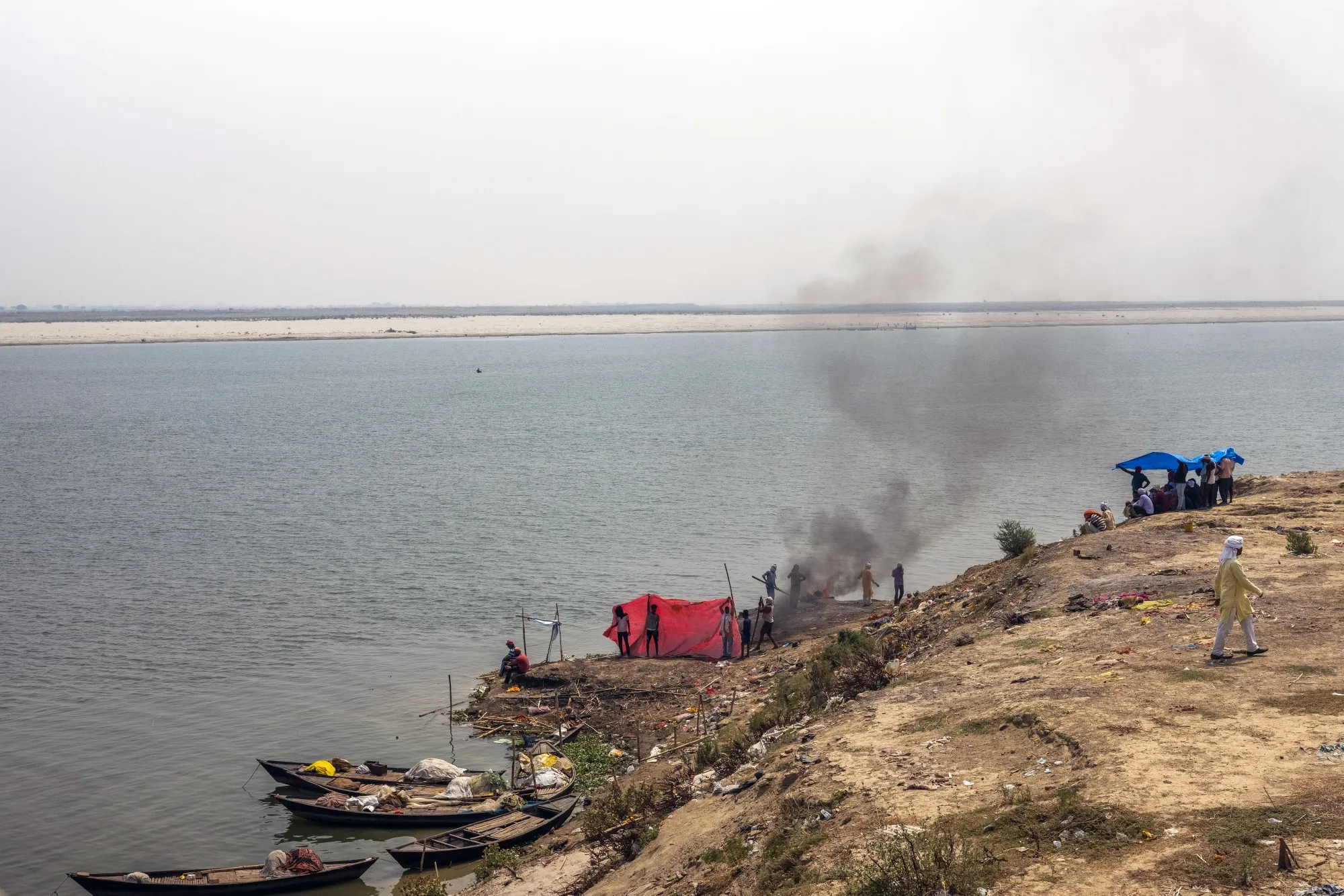 Bodies are cremated by the Ganges&nbsp;river in Ballia on June 23.