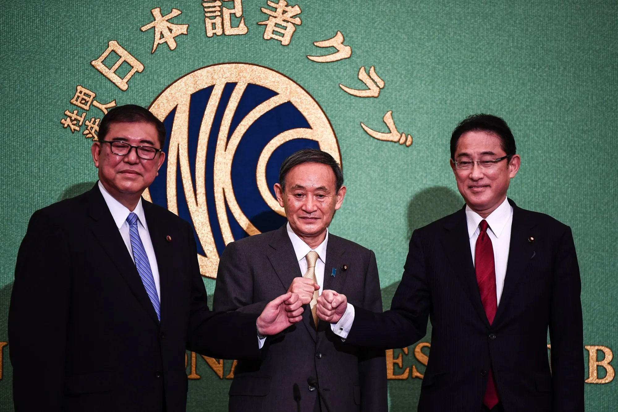 Yoshihide Suga, center, Shigeru Ishiba, left, and Fumio Kishida.