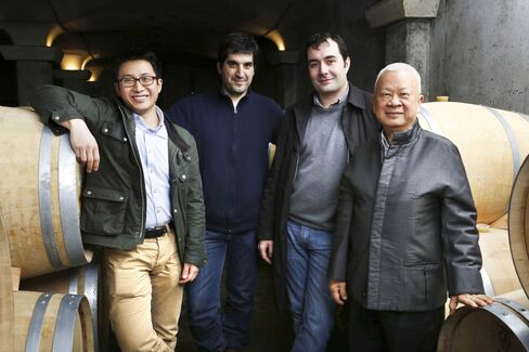 From left: Howard Kwok, winemaker Jerome Aguirre, Vignobles K general manager Jean-Christophe Meyrou, and Peter Kwok pose in the new barrel cellar at Chateau Tour Saint Christophe.
