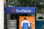 A customer uses an ATM at a SunTrust Banks Inc. branch in St. Petersburg, Florida.