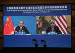 Wang Yi, left, and John Kerry speak via a video link. 