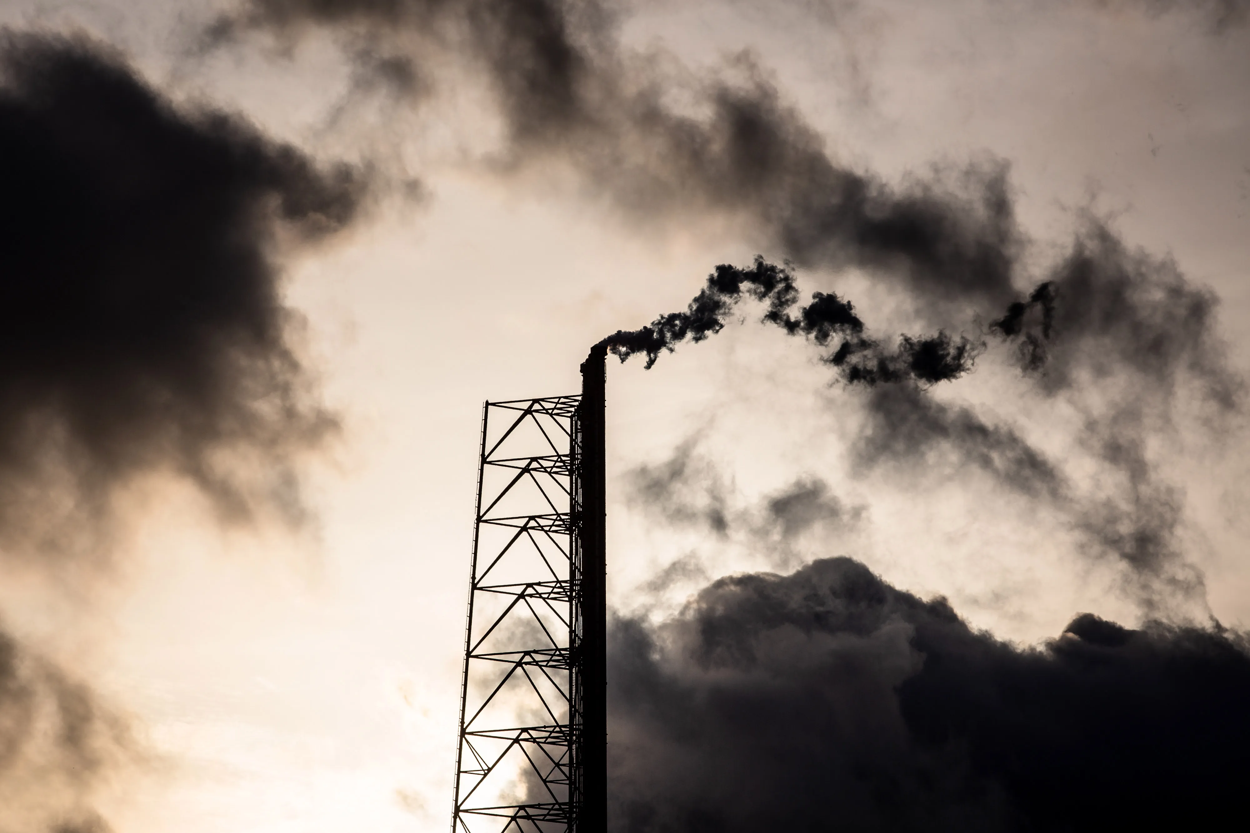 Vapor rises from a chimney.